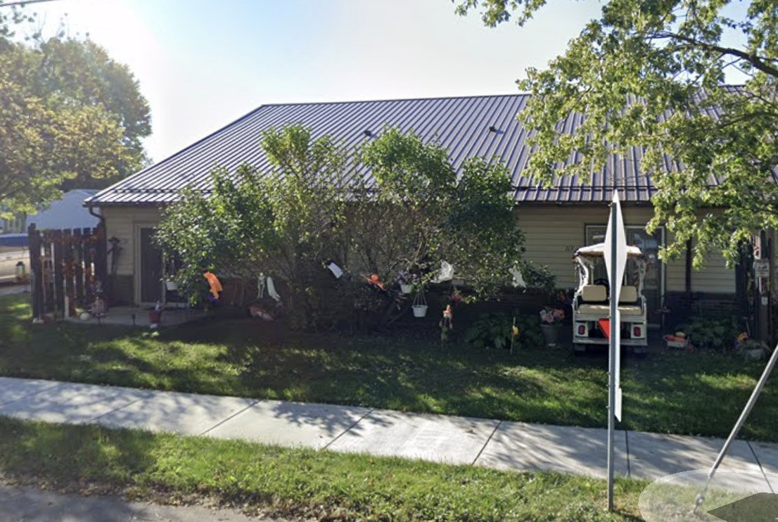 700 West Main Street Redkey, IN 47373 - Photo 3 of 12 a view of a house with a yard and a garden