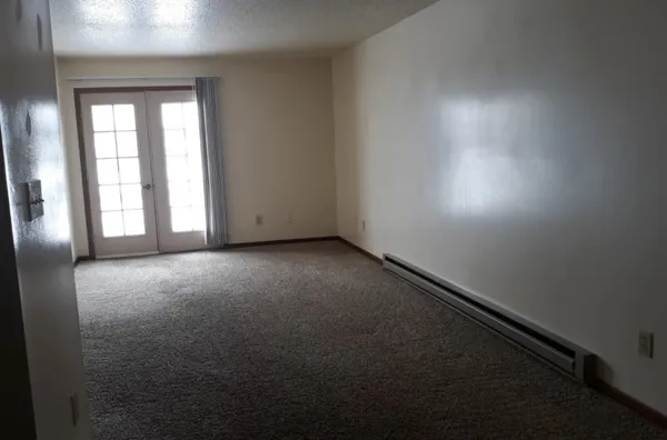 a view of a kitchen from the hallway