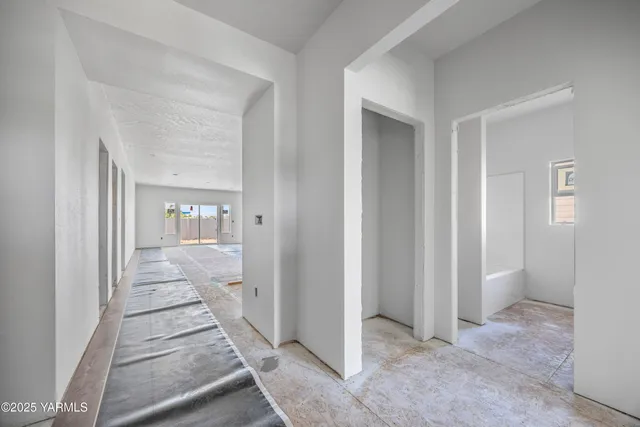 a view of a hallway view with wooden floor and staircase