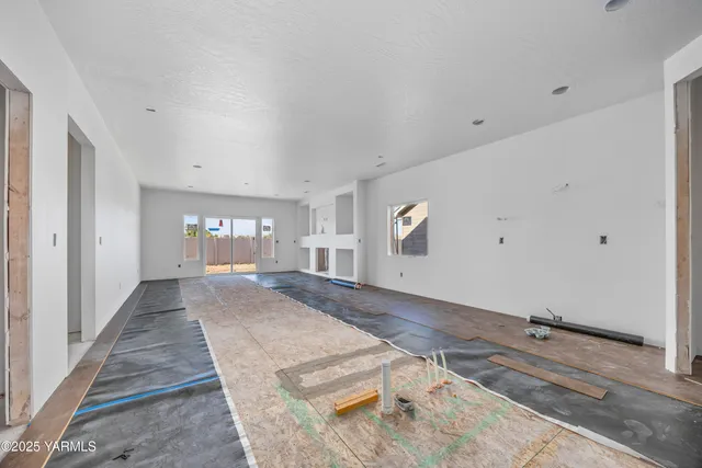 a view of a room with window and stairs