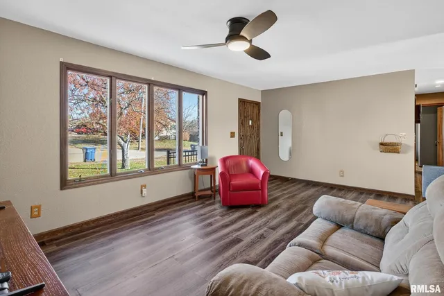 a kitchen with stainless steel appliances a stove microwave and sink