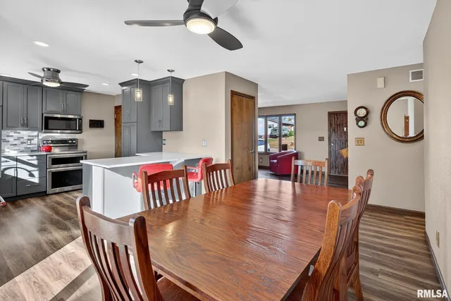 a kitchen with stainless steel appliances a refrigerator sink and cabinets