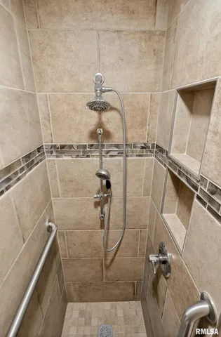 a view of a dining room with furniture and a window
