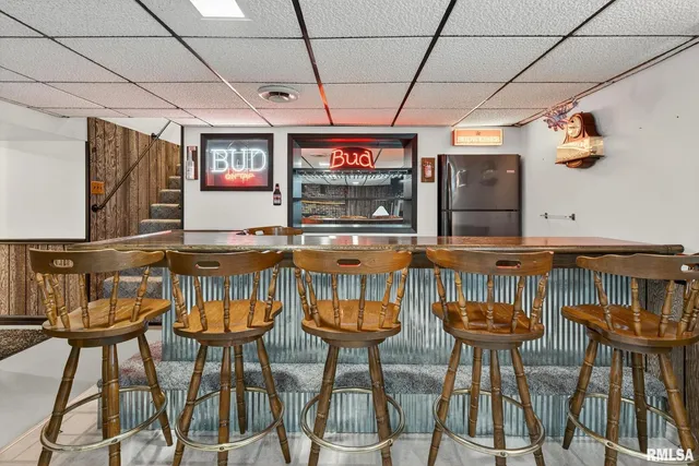 a living room with furniture ceiling fan and a rug