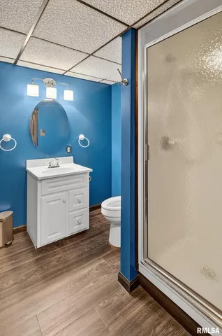 an aerial view of a house with garden space and street view