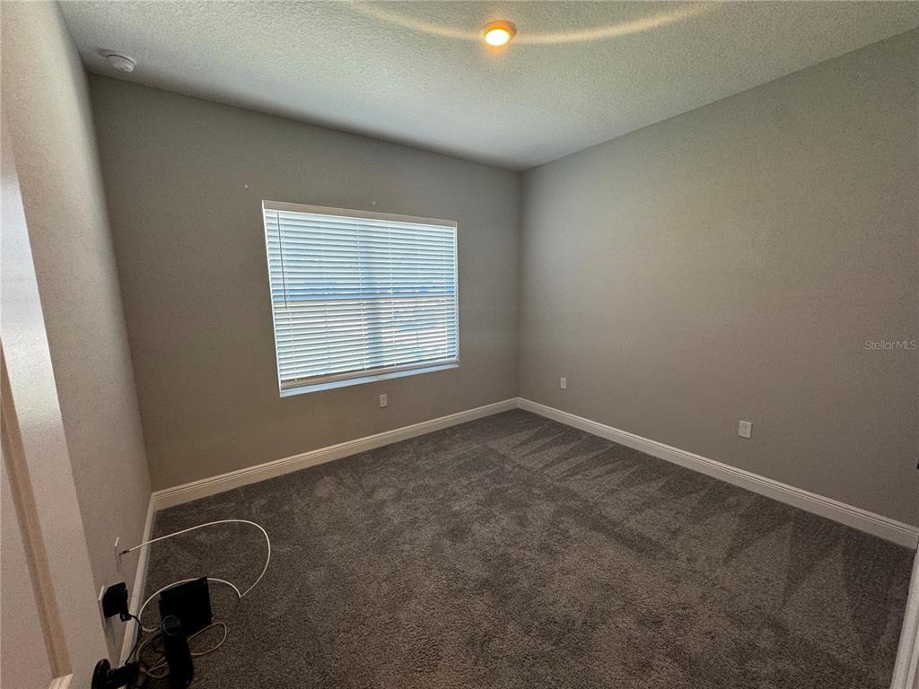 13101 Southwest 72nd Terrace Road Ocala, FL 34473 - Photo 11 of 18 an empty room with a window