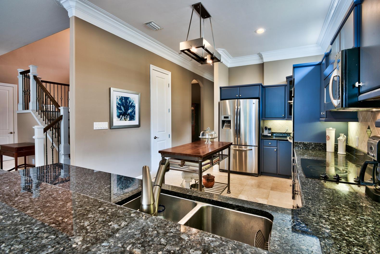 294 Ketch Court Destin, FL 32541 - Photo 12 of 30 a kitchen with stainless steel appliances granite countertop a sink refrigerator and cabinets