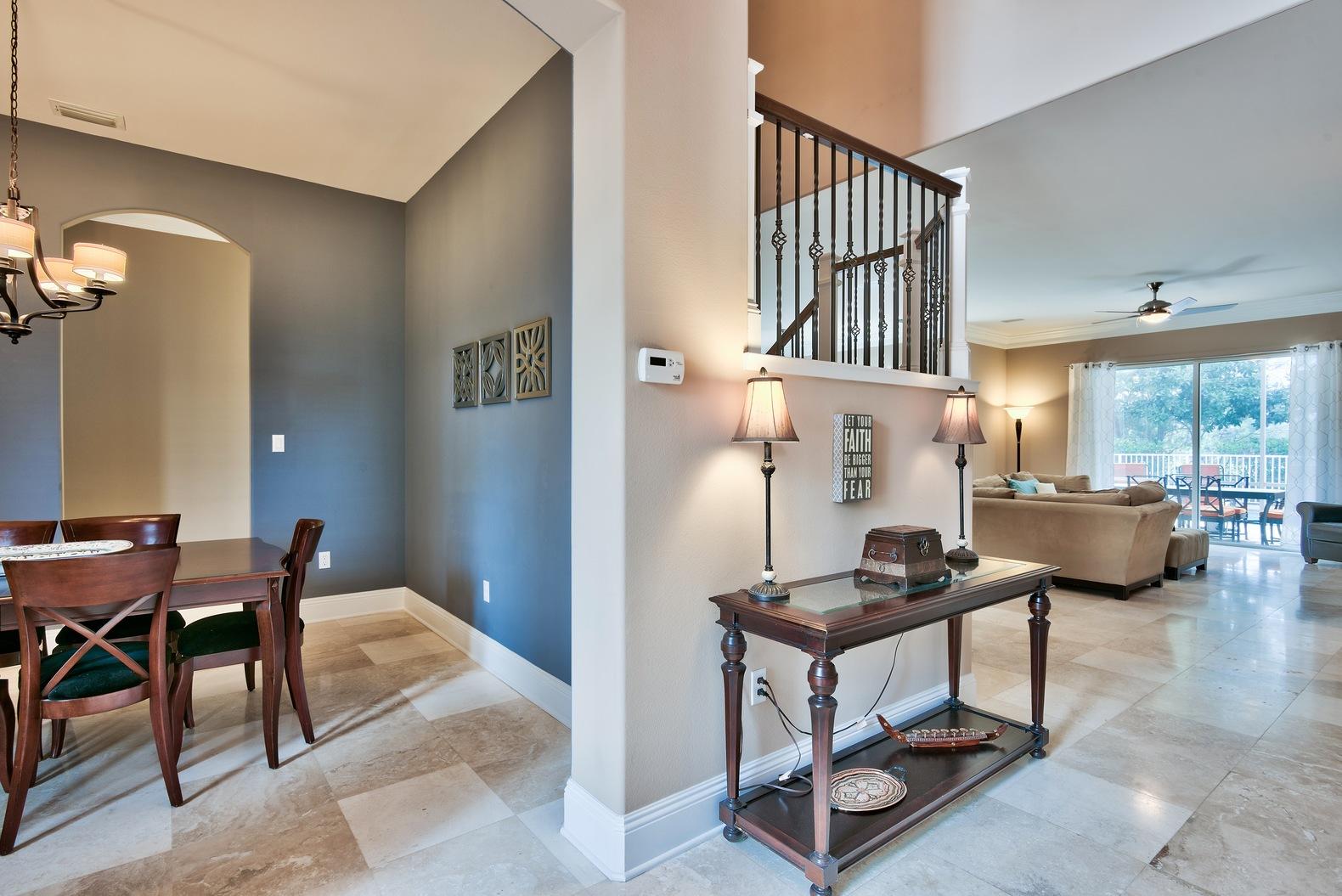 294 Ketch Court Destin, FL 32541 - Photo 2 of 30 a living room with furniture a rug and a chandelier
