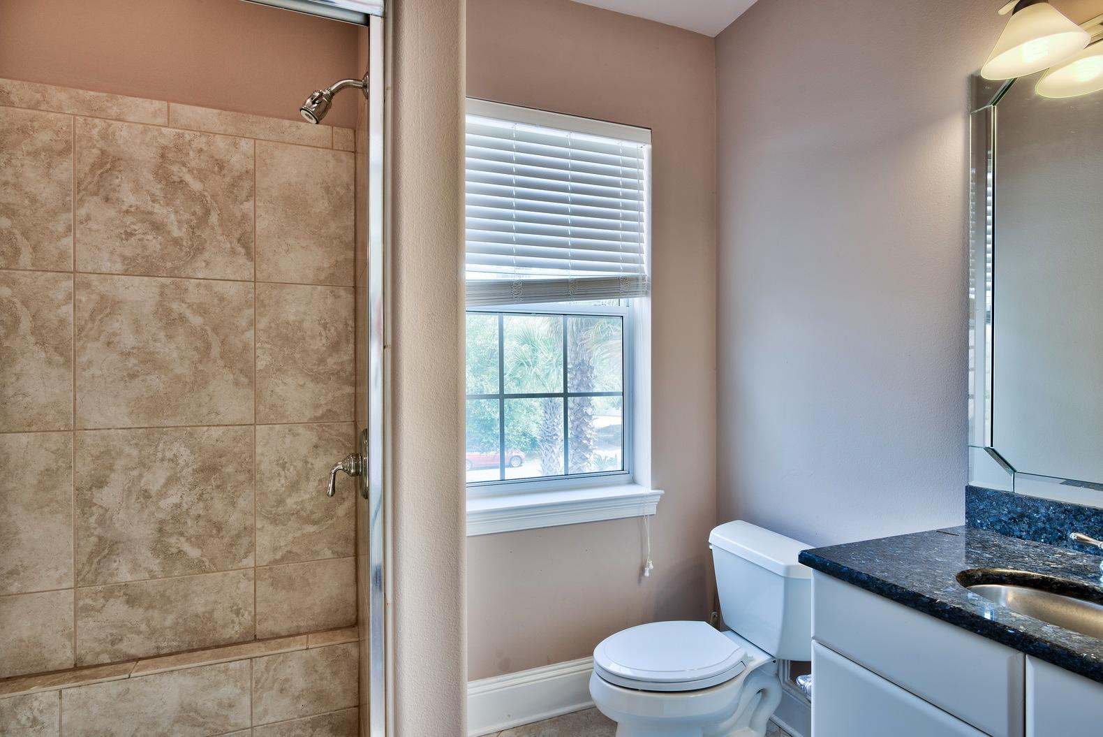 294 Ketch Court Destin, FL 32541 - Photo 24 of 30 a white toilet sitting next to a bathroom sink