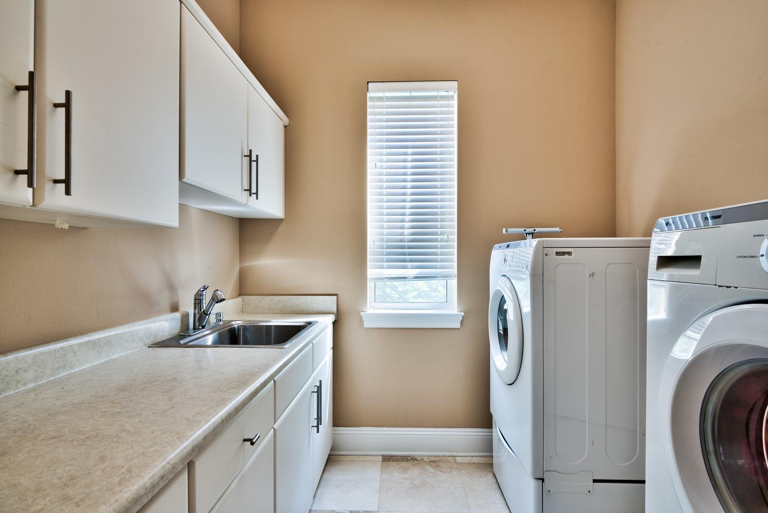 294 Ketch Court Destin, FL 32541 - Photo 25 of 30 a kitchen with a sink a stove and a refrigerator