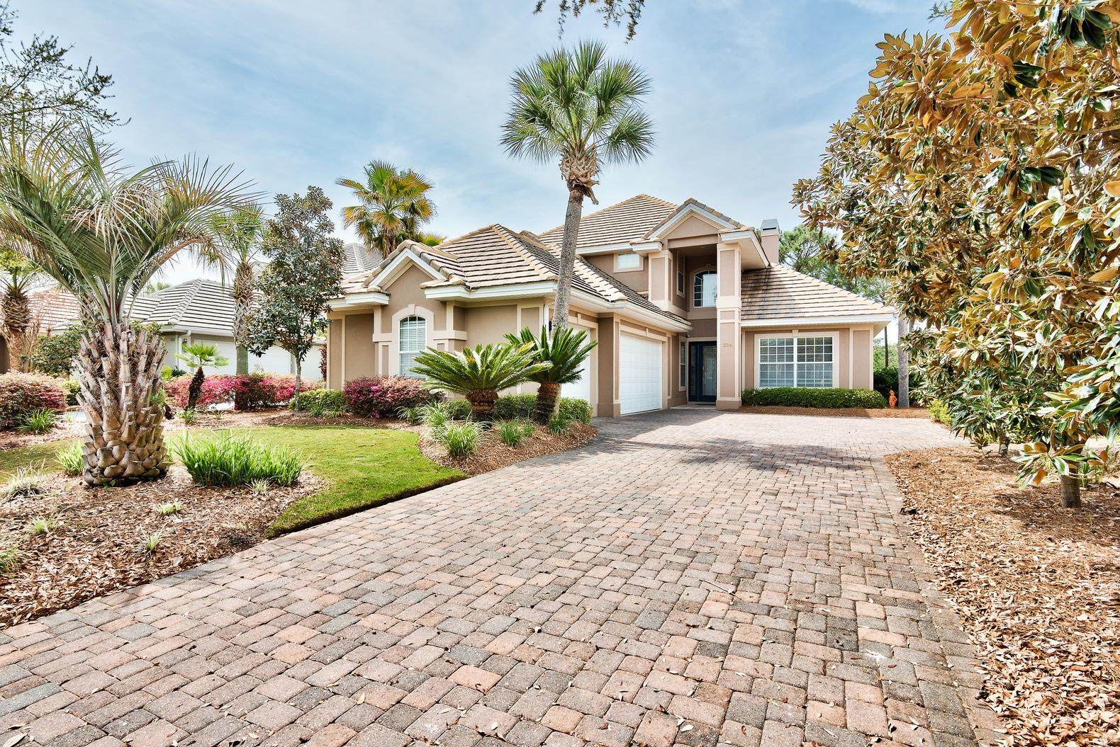 294 Ketch Court Destin, FL 32541 - Photo 29 of 30 a front view of a house with a garden