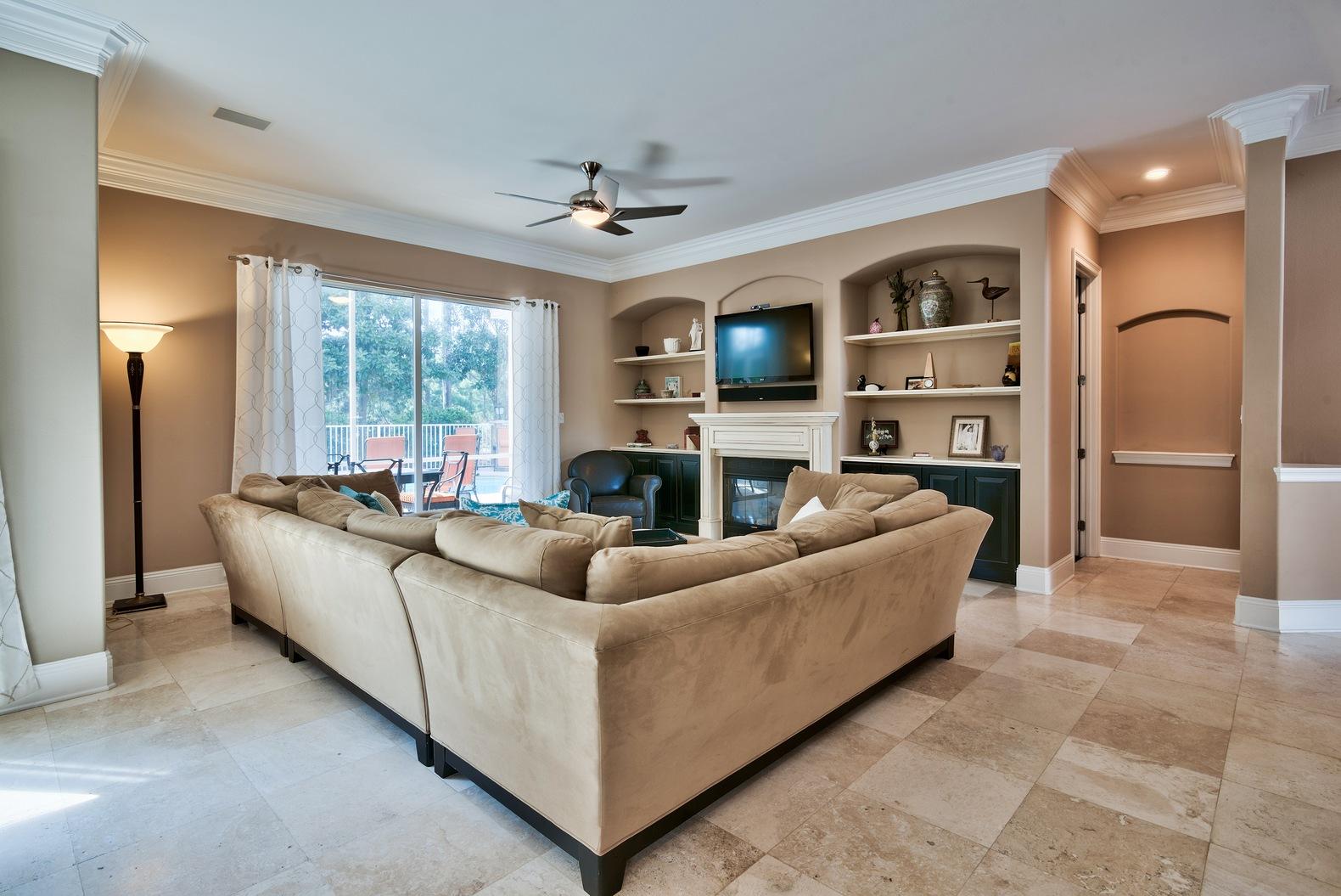 294 Ketch Court Destin, FL 32541 - Photo 4 of 30 a living room with furniture a fireplace and a flat screen tv