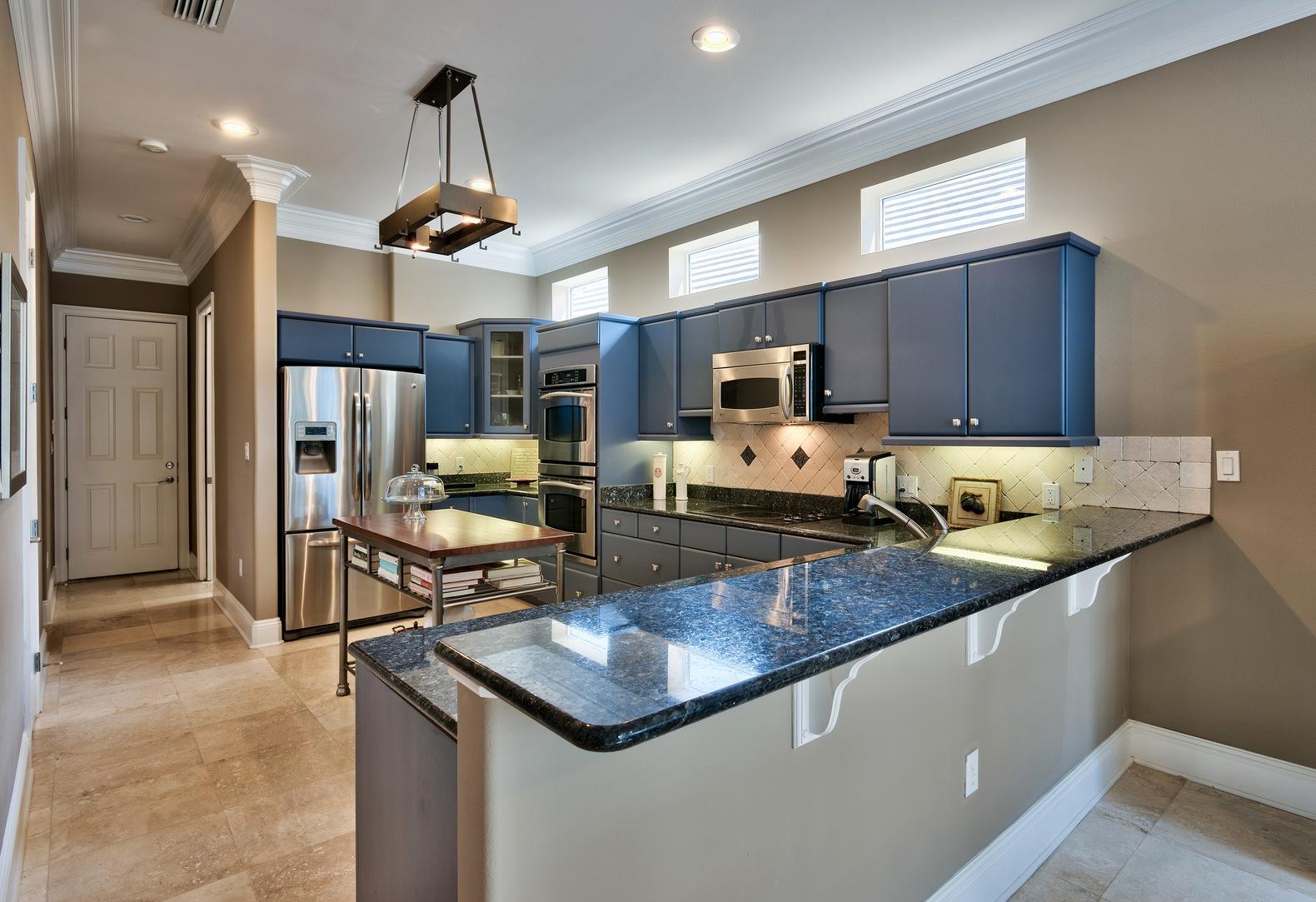 294 Ketch Court Destin, FL 32541 - Photo 9 of 30 a kitchen with stainless steel appliances granite countertop a sink refrigerator and cabinets