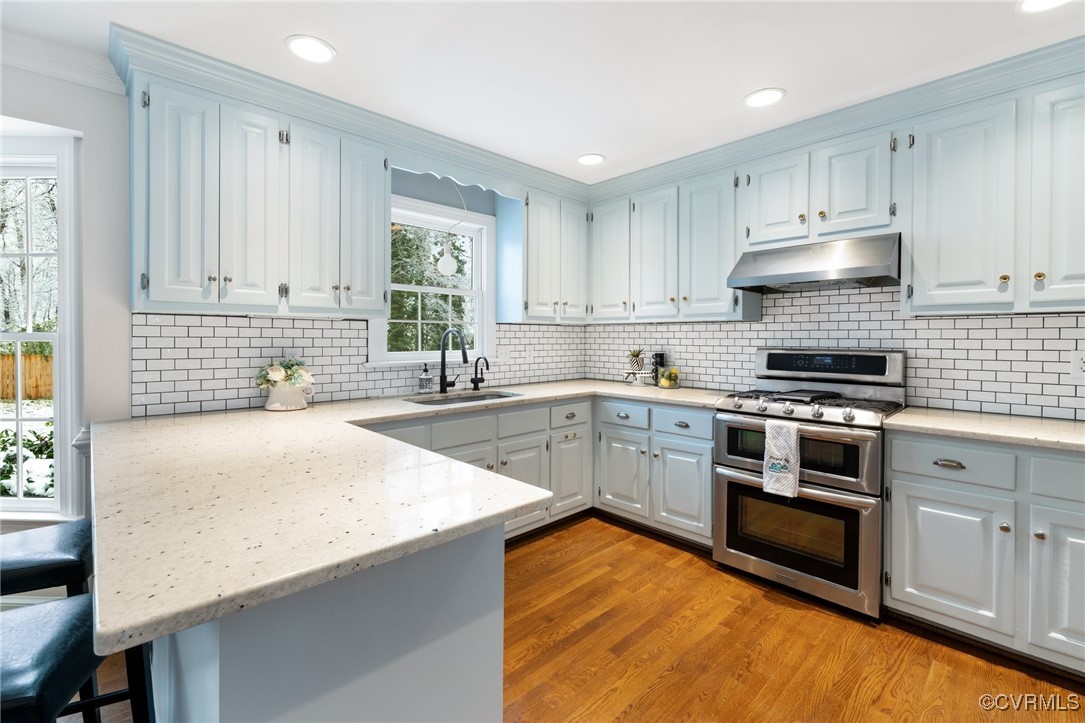 2561 Castle Hill Road Midlothian, VA 23113 - Photo 11 of 46 a kitchen with granite countertop a stove sink and cabinets