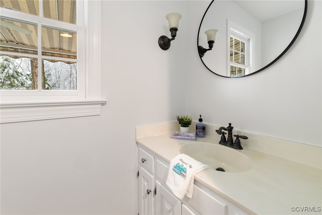 2561 Castle Hill Road Midlothian, VA 23113 - Photo 20 of 46 a bathroom with a sink and a mirror