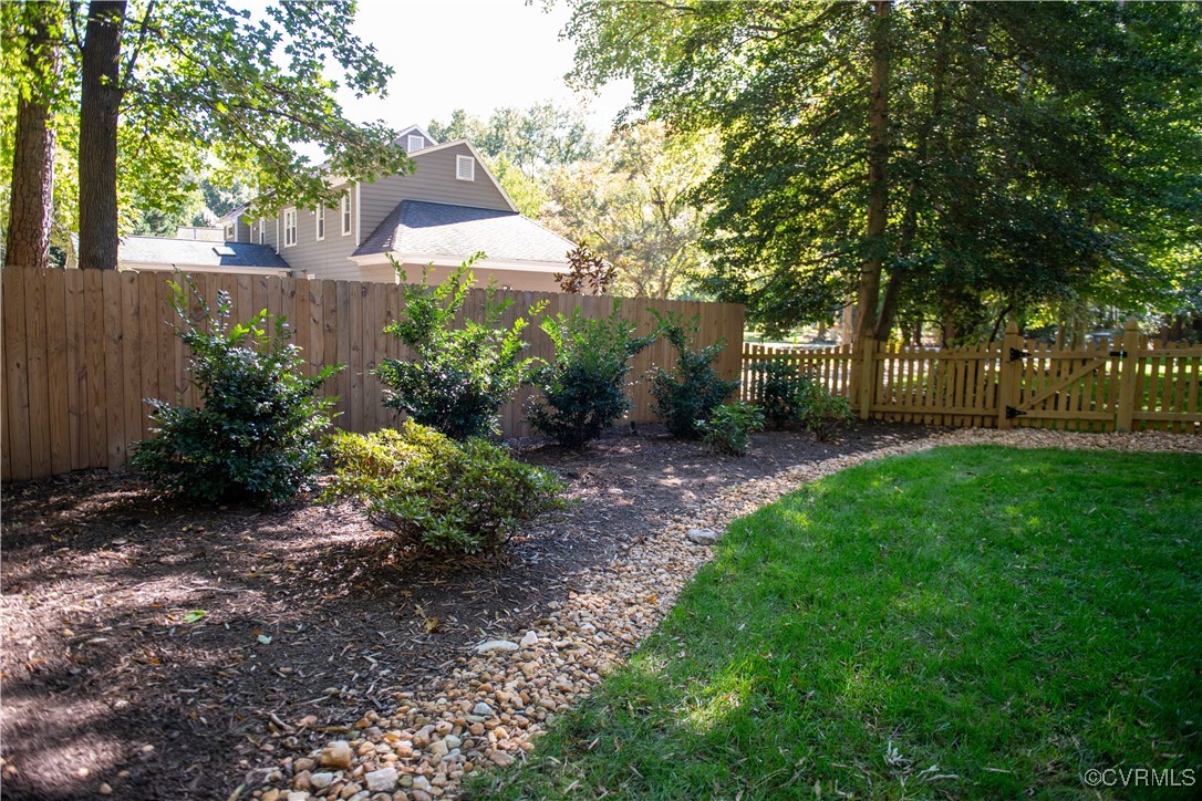 2561 Castle Hill Road Midlothian, VA 23113 - Photo 34 of 46 a view of a garden with plants and large trees
