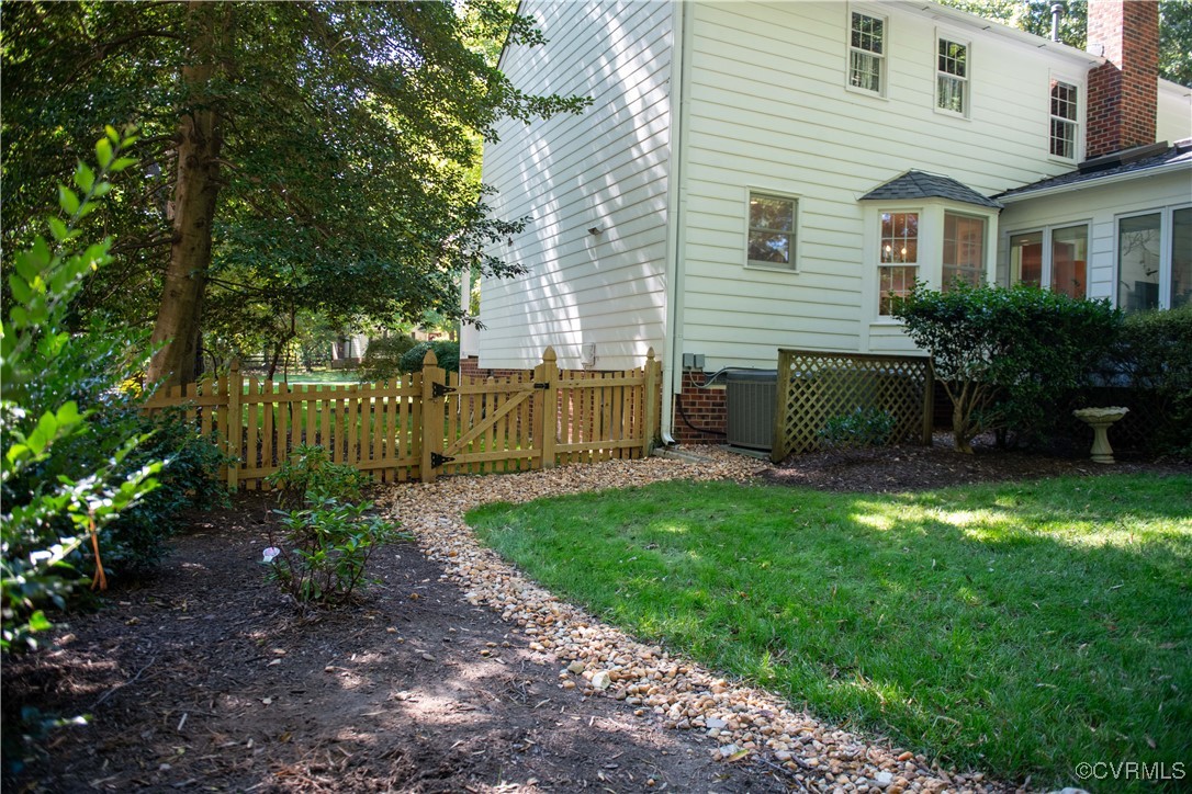 2561 Castle Hill Road Midlothian, VA 23113 - Photo 37 of 46 a view of a house with a yard and a garden