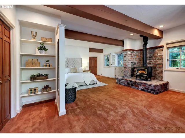 a living room with furniture a flat screen tv and a table