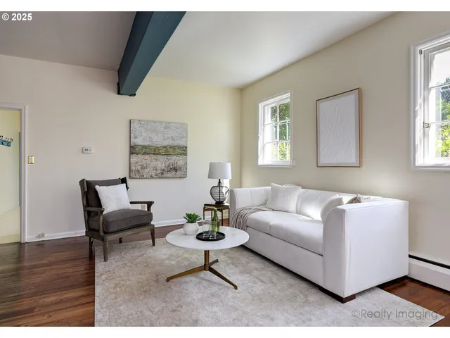 a living room with furniture rug and window