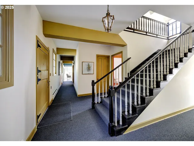 a view of a hallway view with staircase