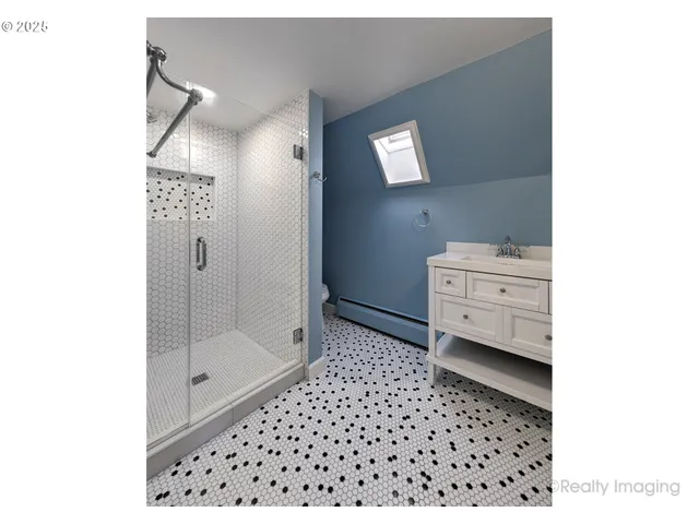 a room with a baby crib and a dresser