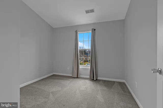 a bathroom with a shower and a toilet