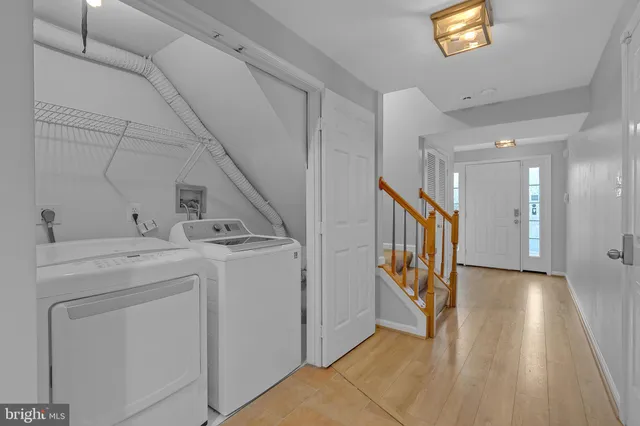 a view of hallway with washer and dryer