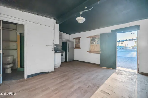 a view of a ceiling fan and wooden floor