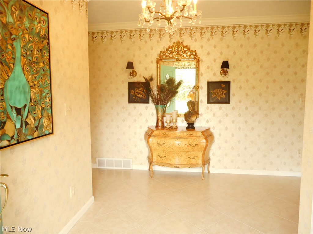 13851 Watt Road Novelty, OH 44072 - Photo 4 of 28 Big, bright foyer has a custom ceramic floor.