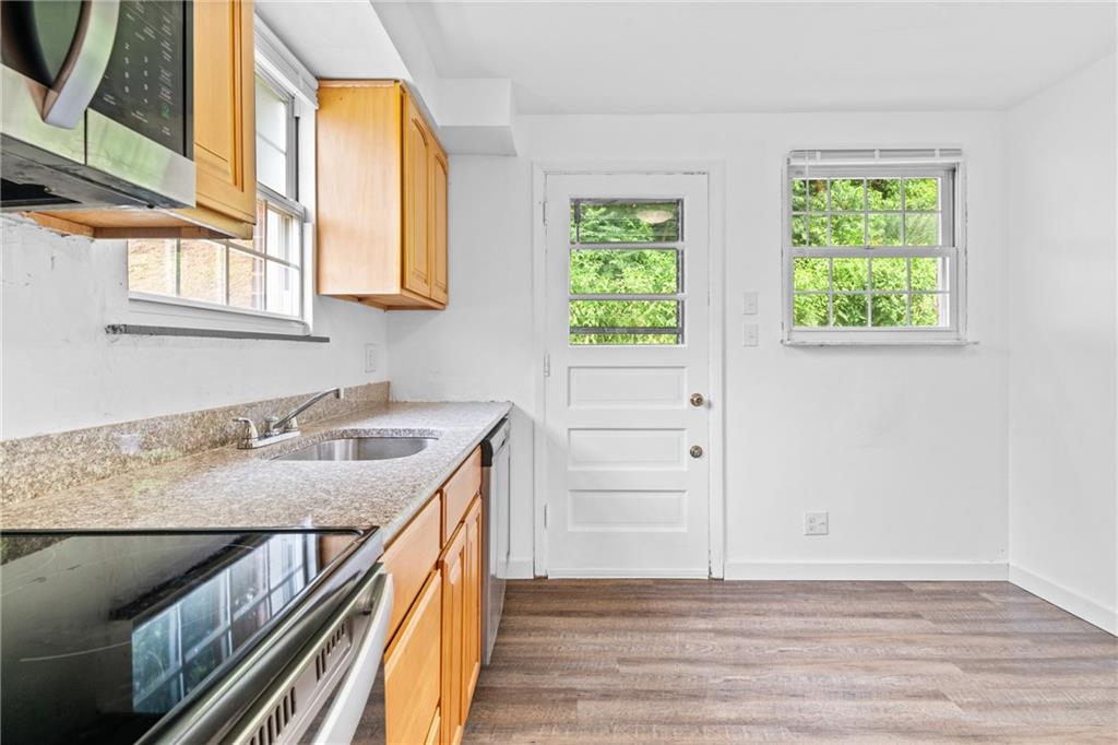 156 Lebeau Pittsburgh, PA 15221 - Photo 15 of 40 a kitchen with a sink and a window