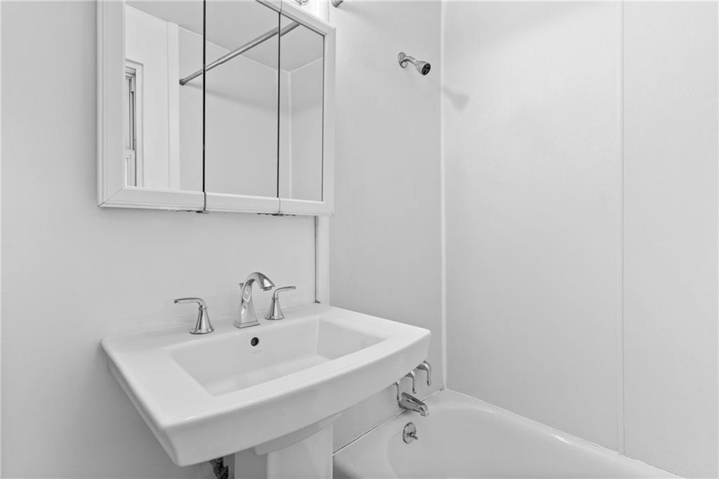 156 Lebeau Pittsburgh, PA 15221 - Photo 21 of 40 a bathroom with a sink and a bathtub