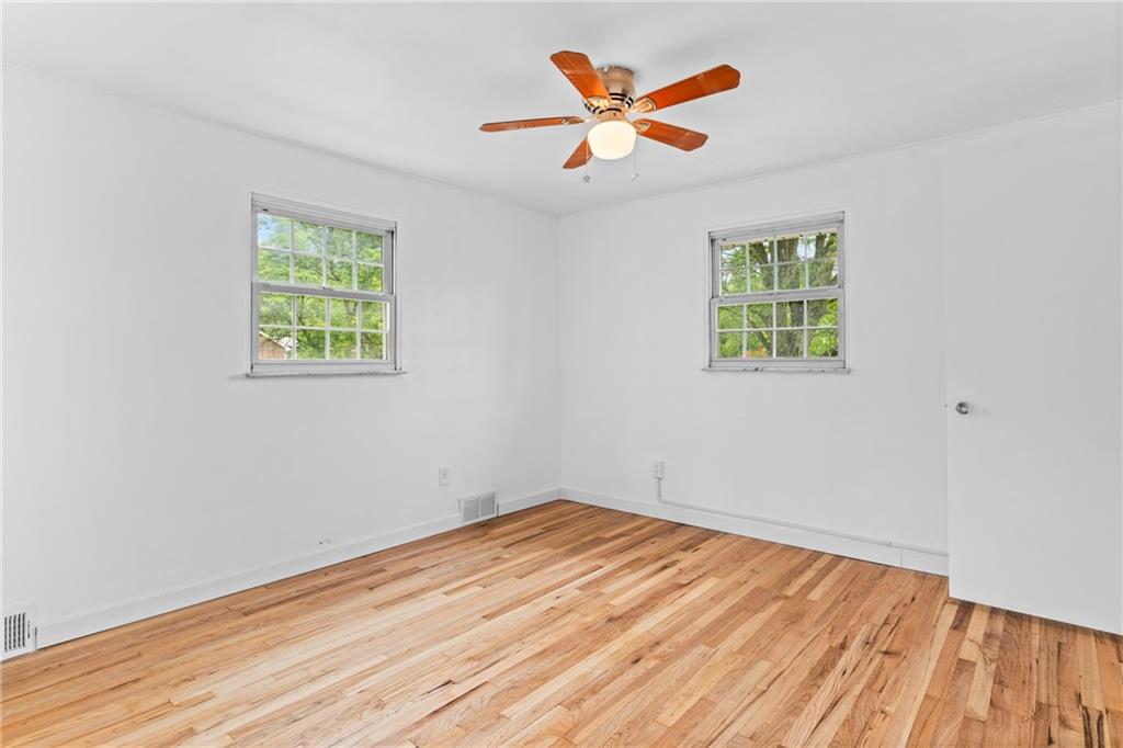 156 Lebeau Pittsburgh, PA 15221 - Photo 23 of 40 a view of a room with wooden floor and a window