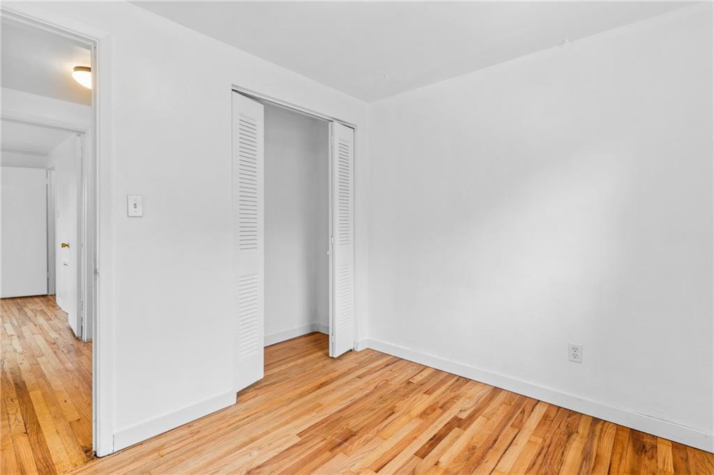 156 Lebeau Pittsburgh, PA 15221 - Photo 26 of 40 a view of empty room with wooden floor