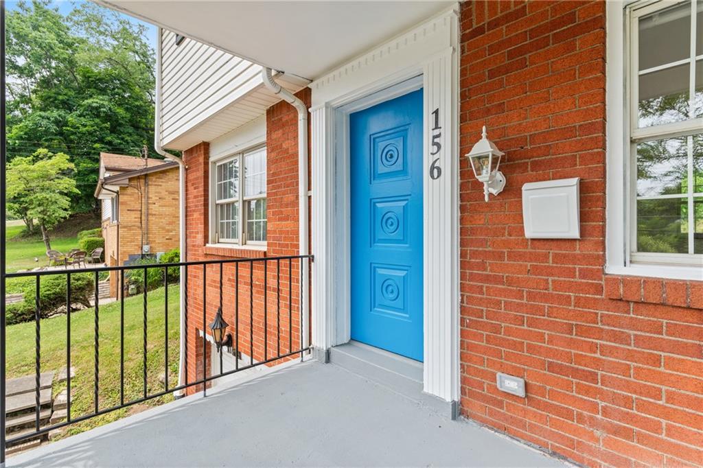 156 Lebeau Pittsburgh, PA 15221 - Photo 6 of 40 a view of a brick house with a large window