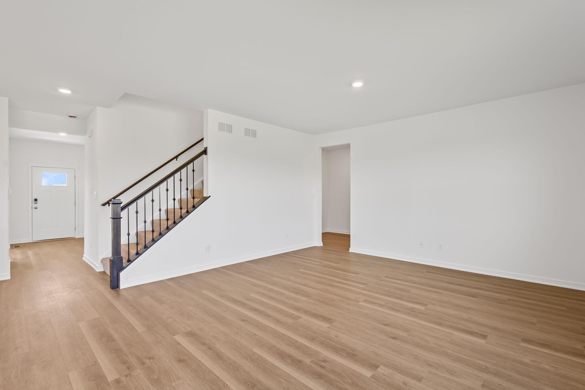 7653 West 106th Place Crown Point, IN 46307 - Photo 32 of 55 a view of an empty room with wooden floor