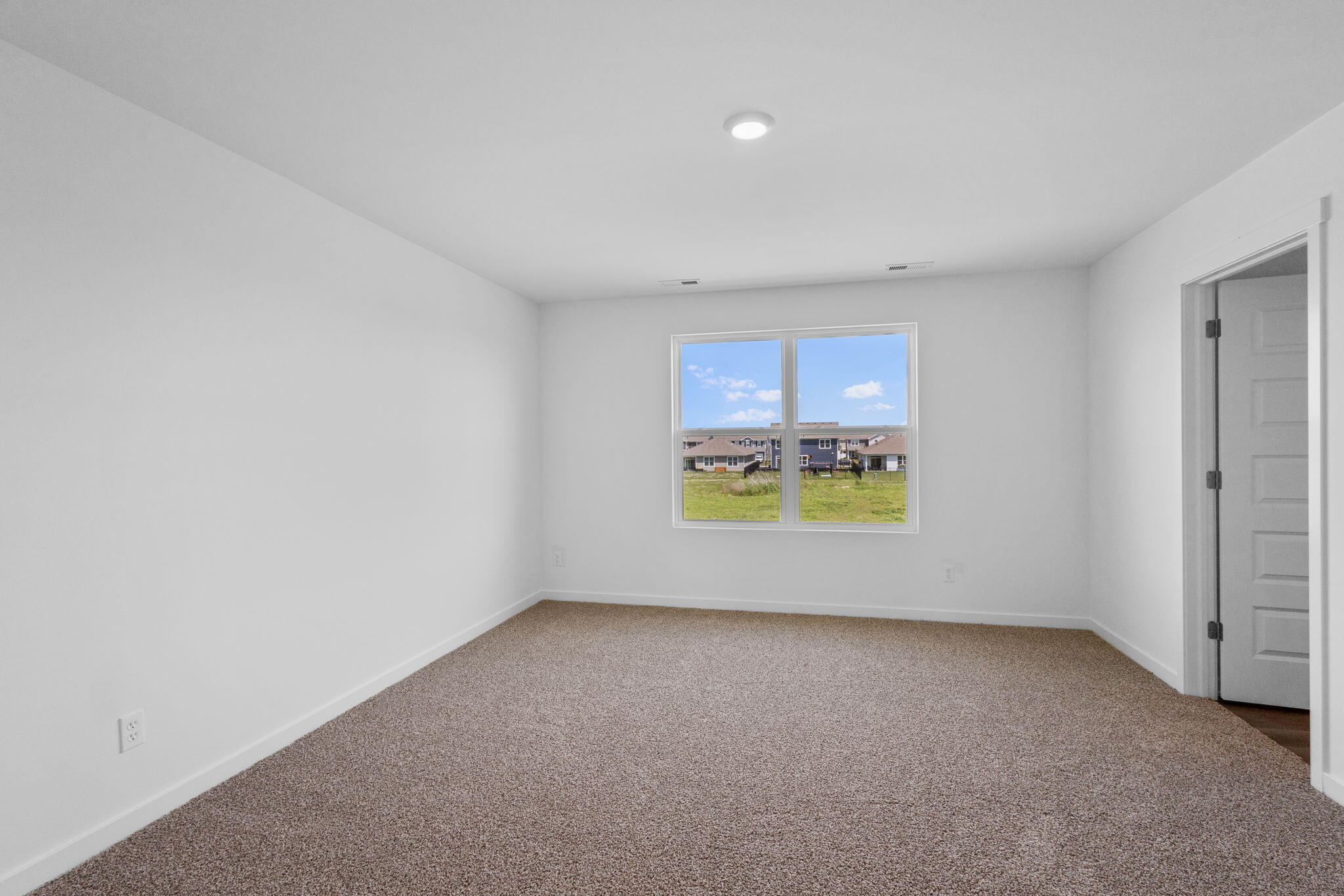 7653 West 106th Place Crown Point, IN 46307 - Photo 43 of 55 a view of an empty room and a window