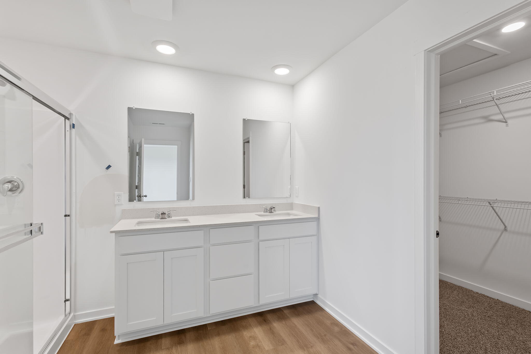 7653 West 106th Place Crown Point, IN 46307 - Photo 45 of 55 a bathroom with a double vanity sink and mirror