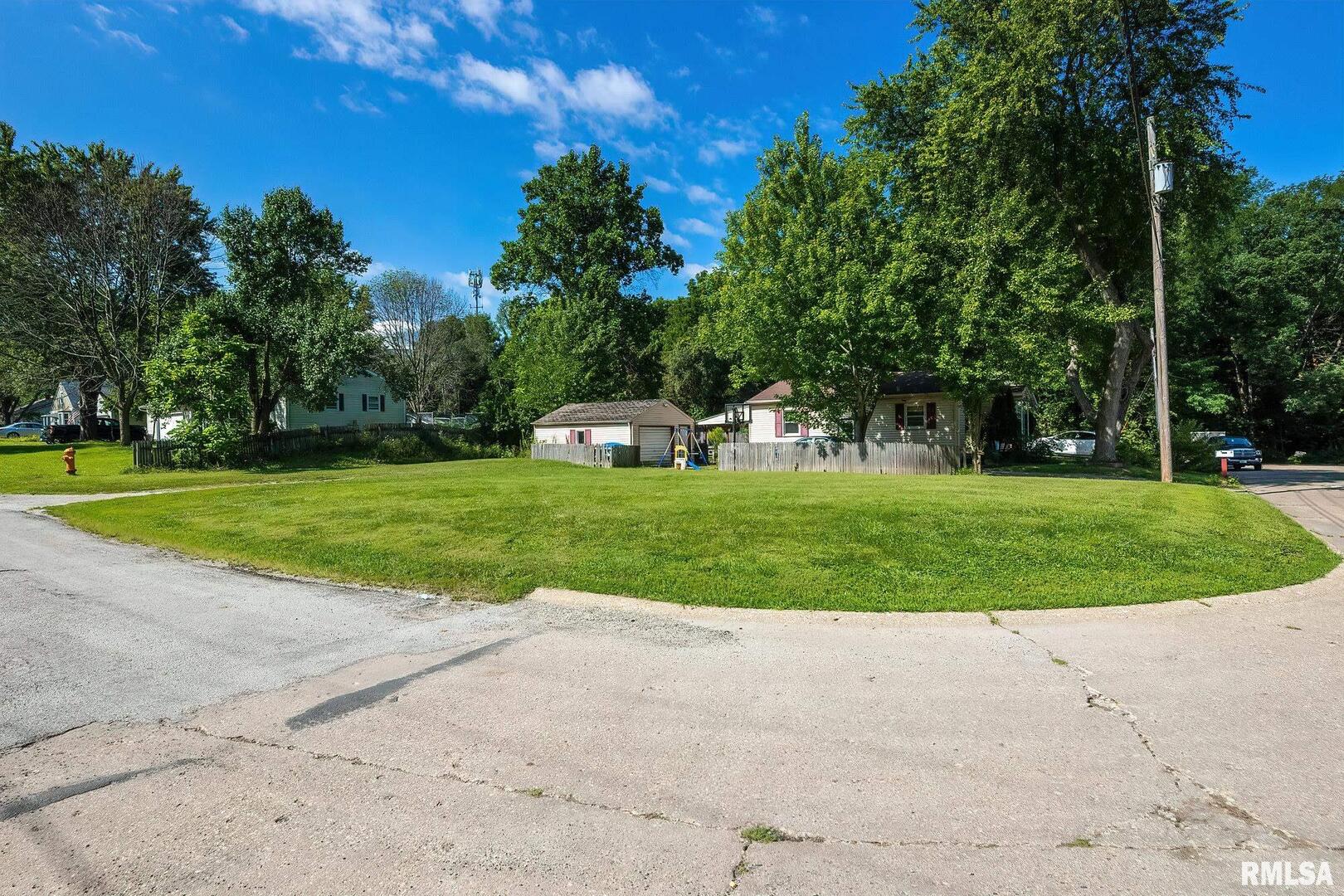 4216 13th Avenue Moline, IL 61265 - Photo 2 of 4 a view of a park with large trees