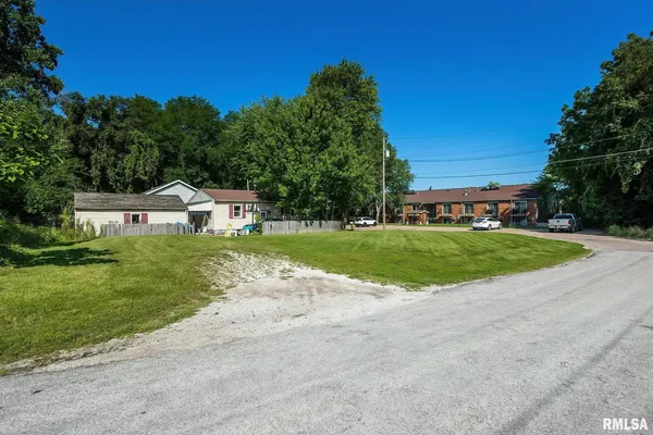 a view of a house with a big yard