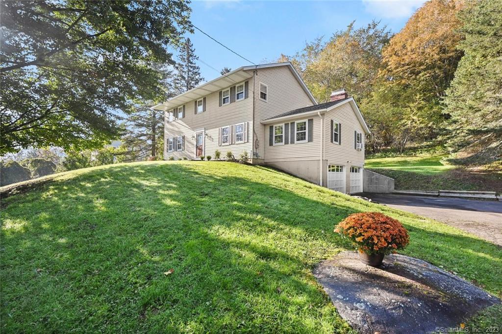 30 East Gate Road Danbury, CT 06811 - Photo 1 of 1 a front view of a house with a yard