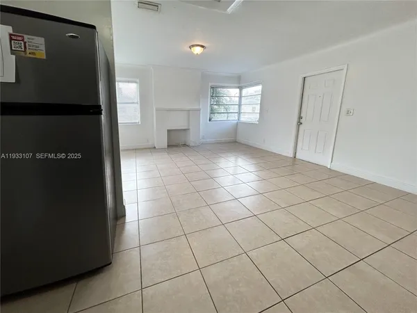 a view of empty room with windows