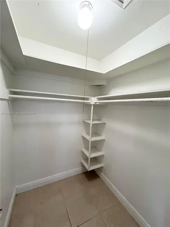 a bathroom with a toilet a sink a mirror and bathtub