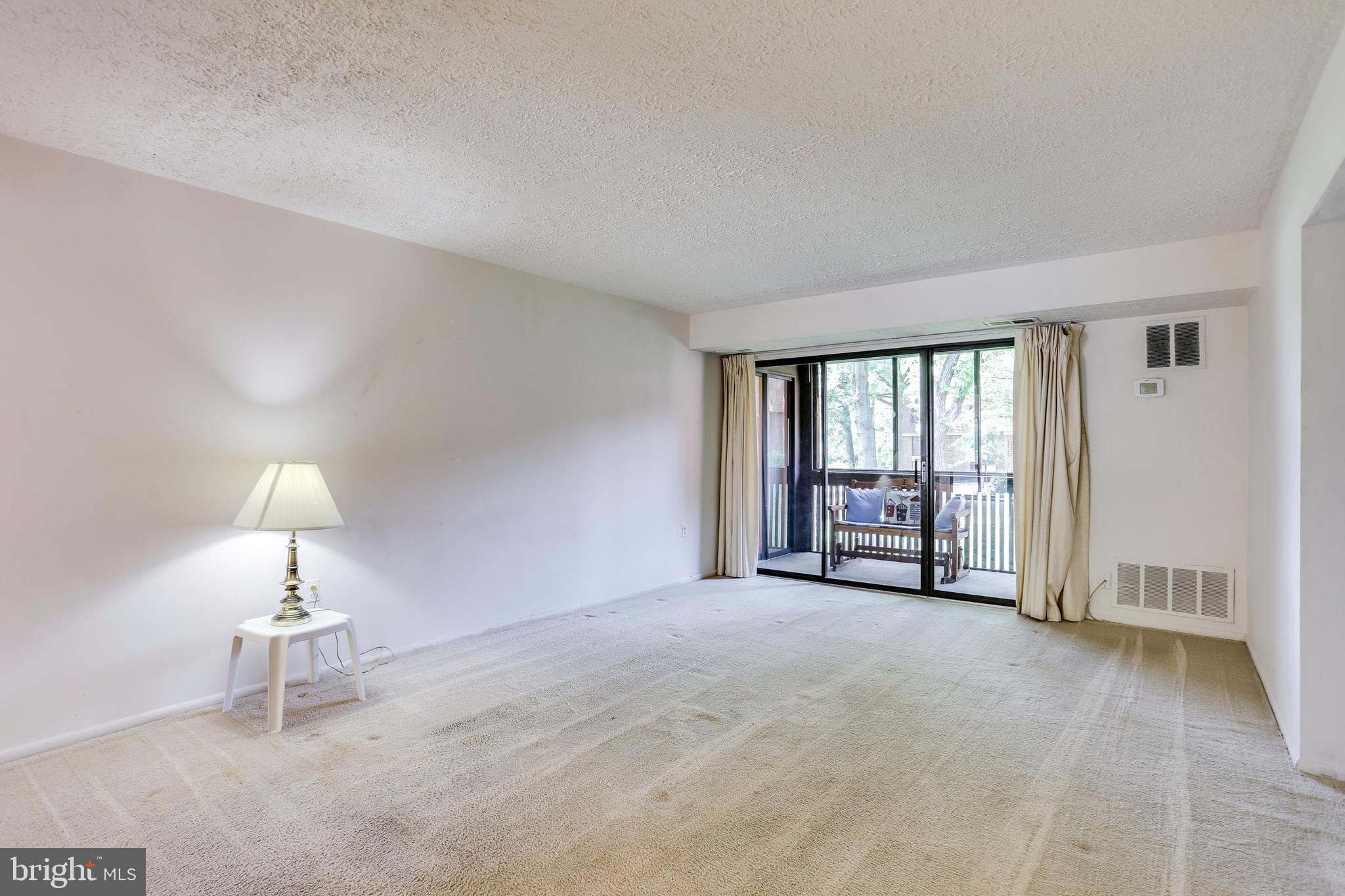 5249 West Running Brook Road, Unit 201 Columbia, MD 21044 - Photo 16 of 32 LIVING ROOM TO PRIVATE BALCONY