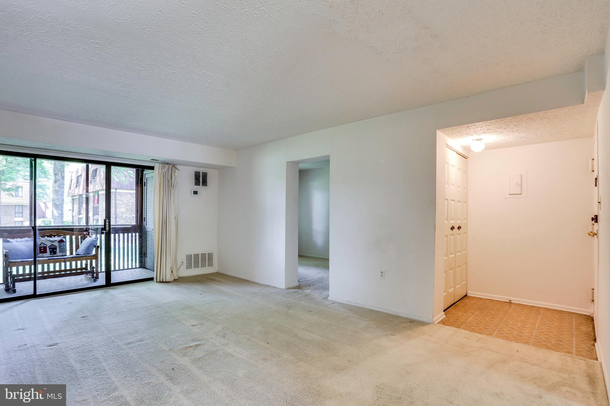 5249 West Running Brook Road, Unit 201 Columbia, MD 21044 - Photo 27 of 32 LIVING ROOM AND BALCONY