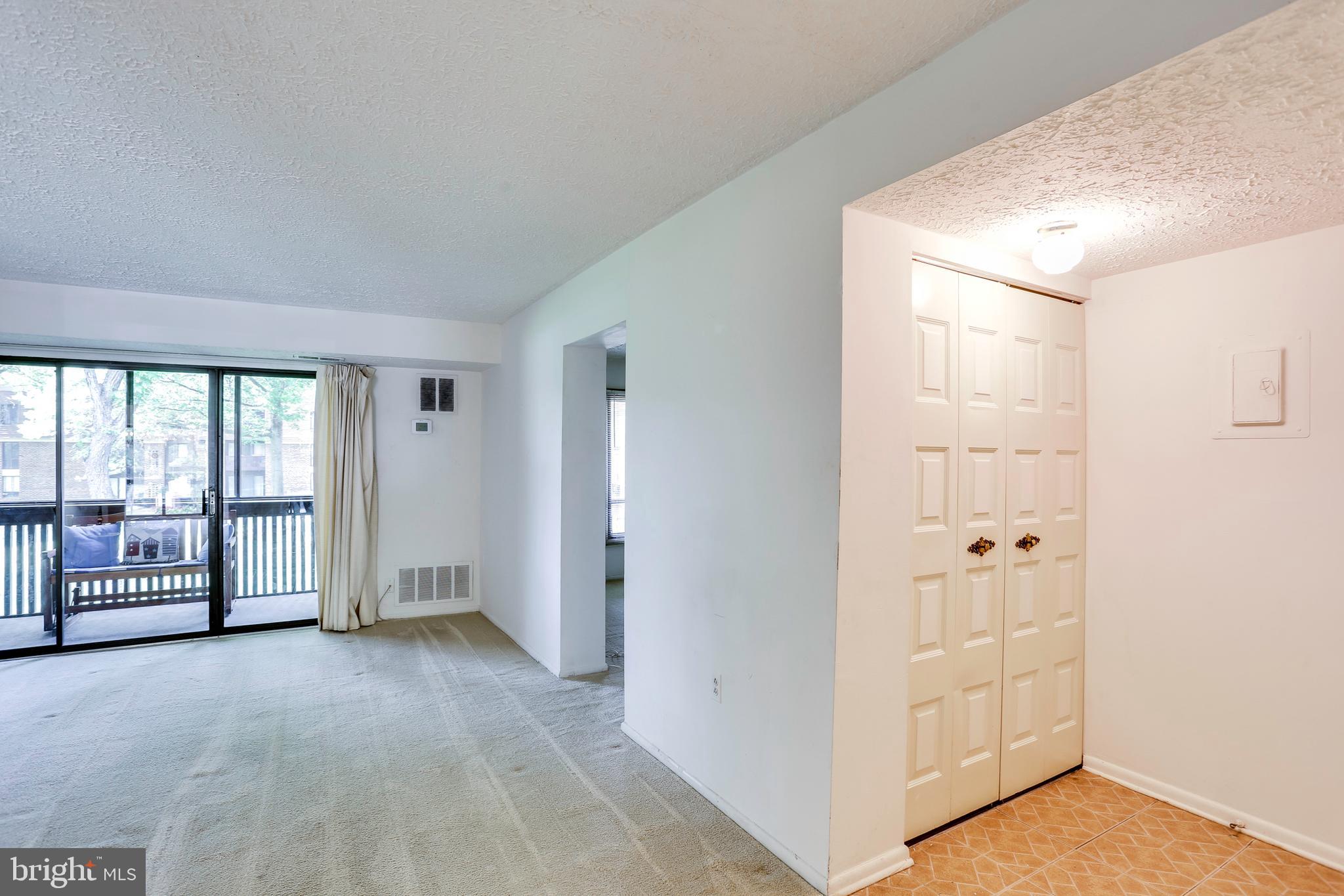 5249 West Running Brook Road, Unit 201 Columbia, MD 21044 - Photo 28 of 32 FOYER AND LIVING ROOM