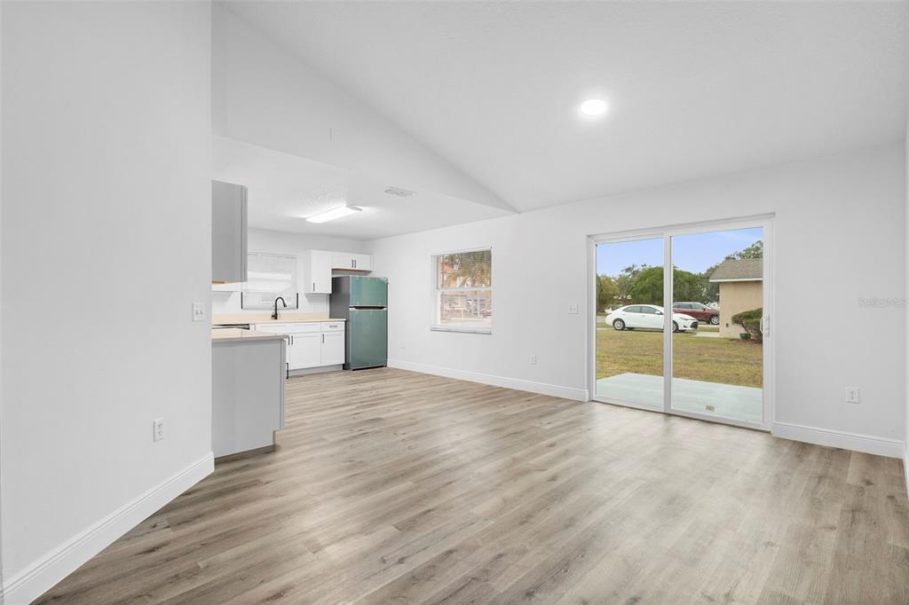 860 South Grove Street Eustis, FL 32726 - Photo 36 of 54 a view of a kitchen with wooden floor and a sink
