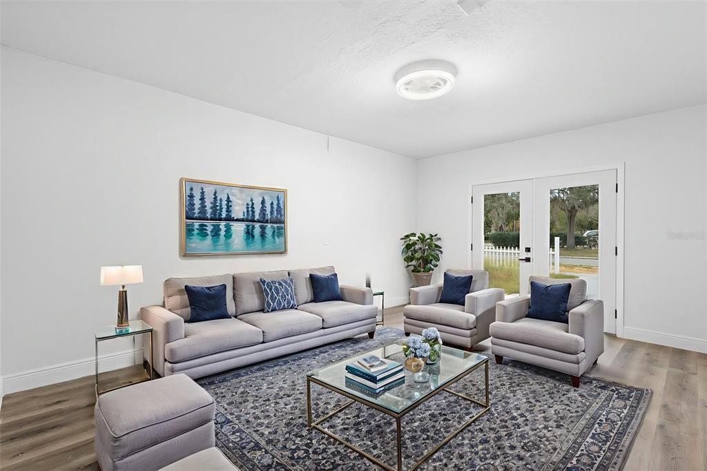 860 South Grove Street Eustis, FL 32726 - Photo 53 of 54 a living room with furniture couches and a table