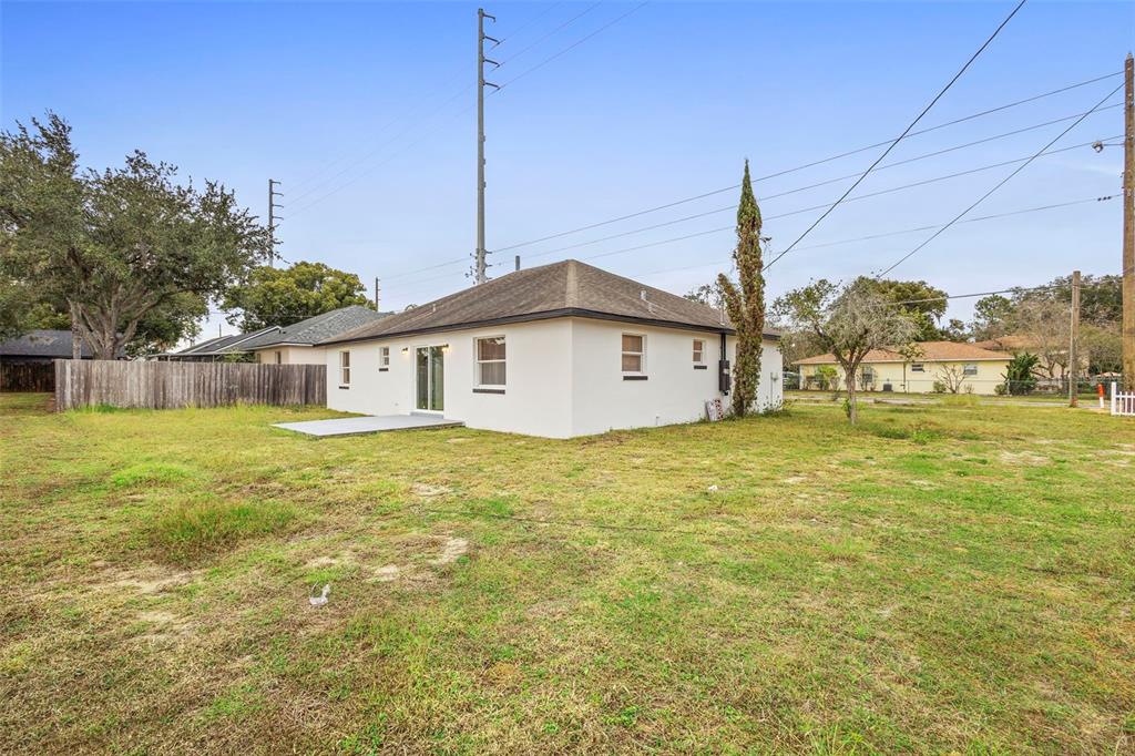 860 South Grove Street Eustis, FL 32726 - Photo 6 of 54 a front view of a house with garden