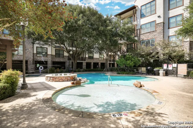 a view of a swimming pool with a patio