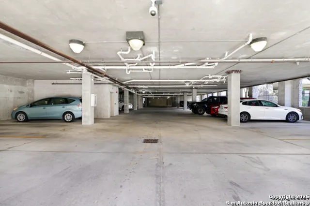 a view of parking space with parked cars